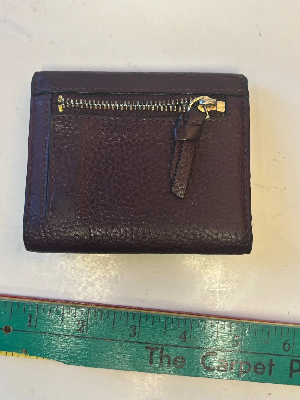 kate spade plum pebbled leather trifold wallet with gold logo